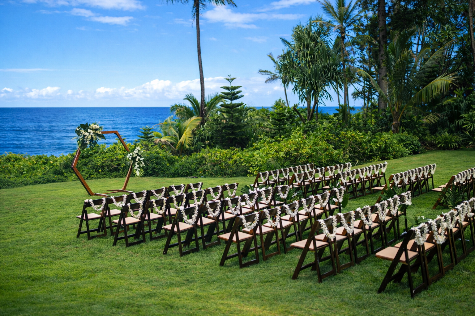Ceremony setup tucked into a lush tropical corner of the estate overlooking the ocean